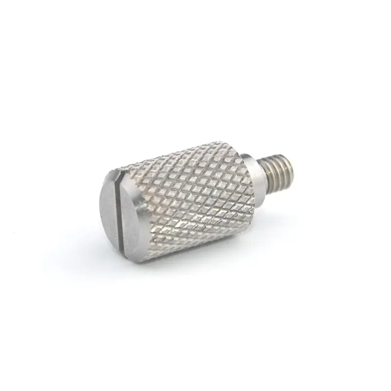Small cylindrical metal part with a knurled surface, slotted end and external threaded stud